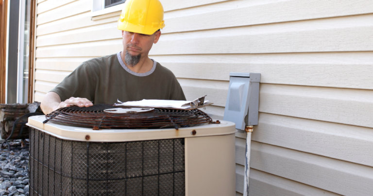 HVAC Technician replacing an old AC unit