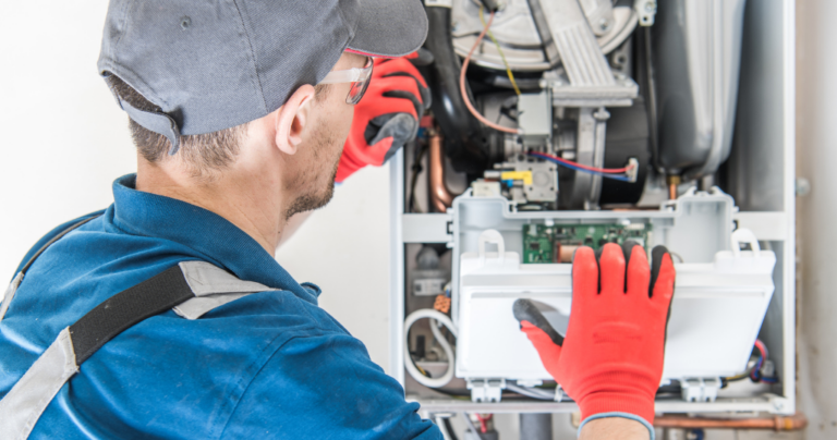 HVAC tech servicing a furnace