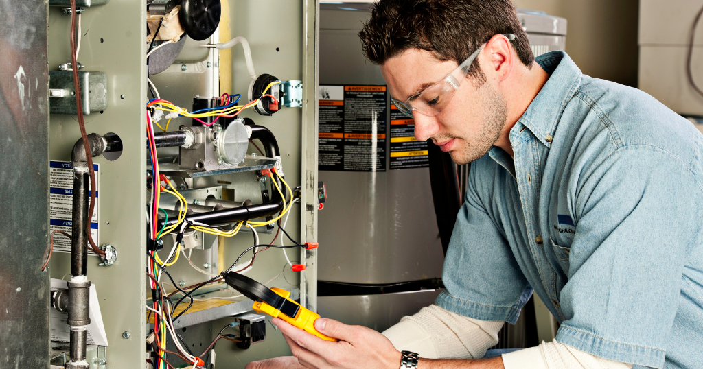 Hvac technician servicing a furnace